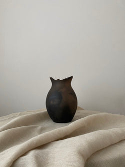 The Suleja vessel is inspired by the irregular shapes, textures and tones found in vessels in progress, by the beauty in asymmetry and the artistry of pottery traditions. Sculpted by hand in limited numbers, each piece is created by artisans using traditional indigenous techniques.